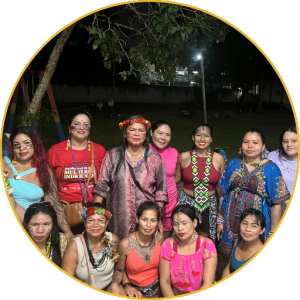 Group of Indigenous women posing together at night
