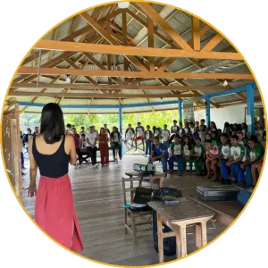 Environmental workshop with young Puyanawa people in a large covered space