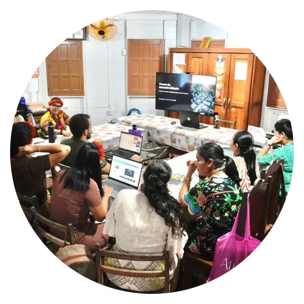 Indigenous teachers working on computers during a training session
